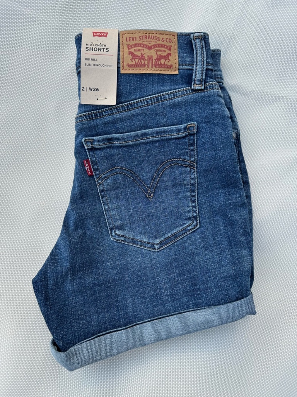 Levi's Women's Mid-Blue Rolled Hem Distressed Denim Shorts size 26